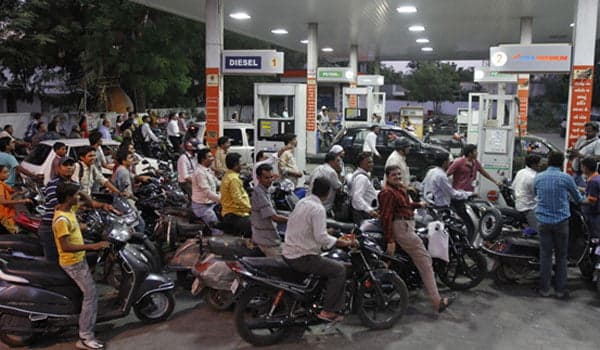 Must pay up: Consumers in India grappled with record high fuel prices as crude oil topped $80/barrel
