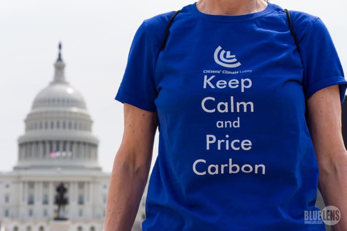 A climate protestor advocating for taxing carbon at a rally in Washington DC, USA. Photo: Wikimedia Commons